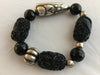 BBLK1S blends carved and faceted Onyx with unusual silver tone pieces.