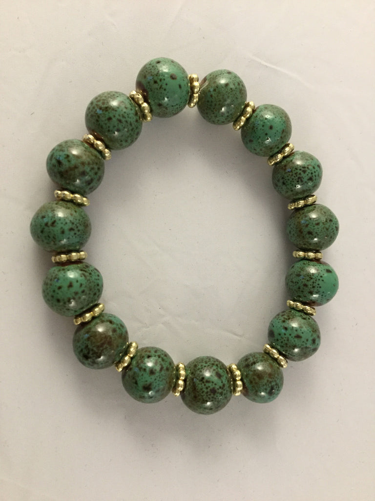 BG1S has 10mm green ceramic balls with gold tone star inserts. It is $30.