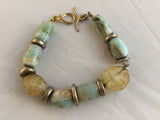 BG7S  has tubular and oval chalcedony, citrine nuggets  with gold filled inserts and toggle clasp. $85.00