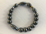 BGY10S has 8mm Hematite beads with 3 5x20 Hematite cylinders with bronze coloured metal inserts