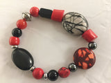 BR2S combines red Agate, Bamboo, Hematite and composite oval stones with silver to make this unique stretch Bracelet.