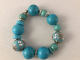 BT2S is a fancy stretch turquoise and Turq/Howlite Bracelet that will spice up your silver bangles.