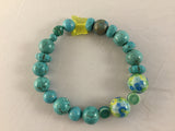 Real 10mm Turquoise balls with 2 yellow/turq ceramic 12mm beads  with floral turquoise/Howlite inserts. can be worn with BTY3S