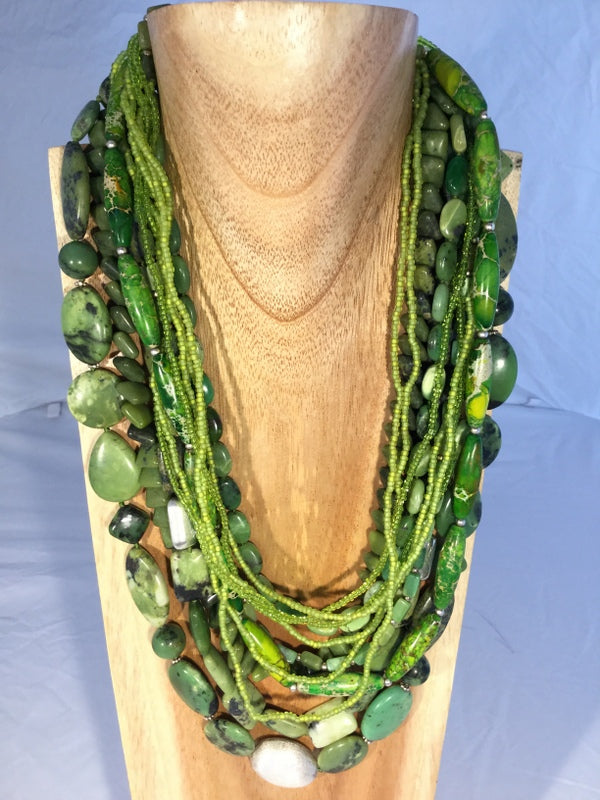 Basile & Basile: Baasile is a 25" 4 strand necklace of Aventurine. It sells for $285.00