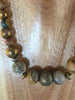 dark gold metal balls mixed with the Jasper and African metal.
