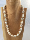 OYSTER; Fresh water  pearls blended with 10mm round pearls, gold filled stars and lobster clasp.